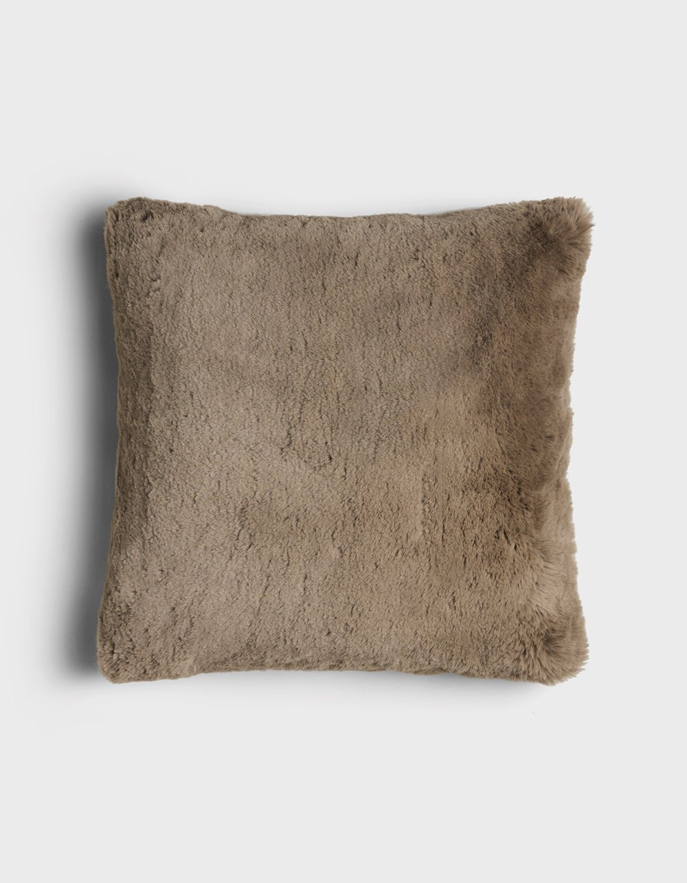 The Cuddle Pillow by Cozy Earth is a square, brown faux fur pillow with a soft, fluffy texture, displayed on a plain white background.|Color:Walnut |Size:24" x 24"