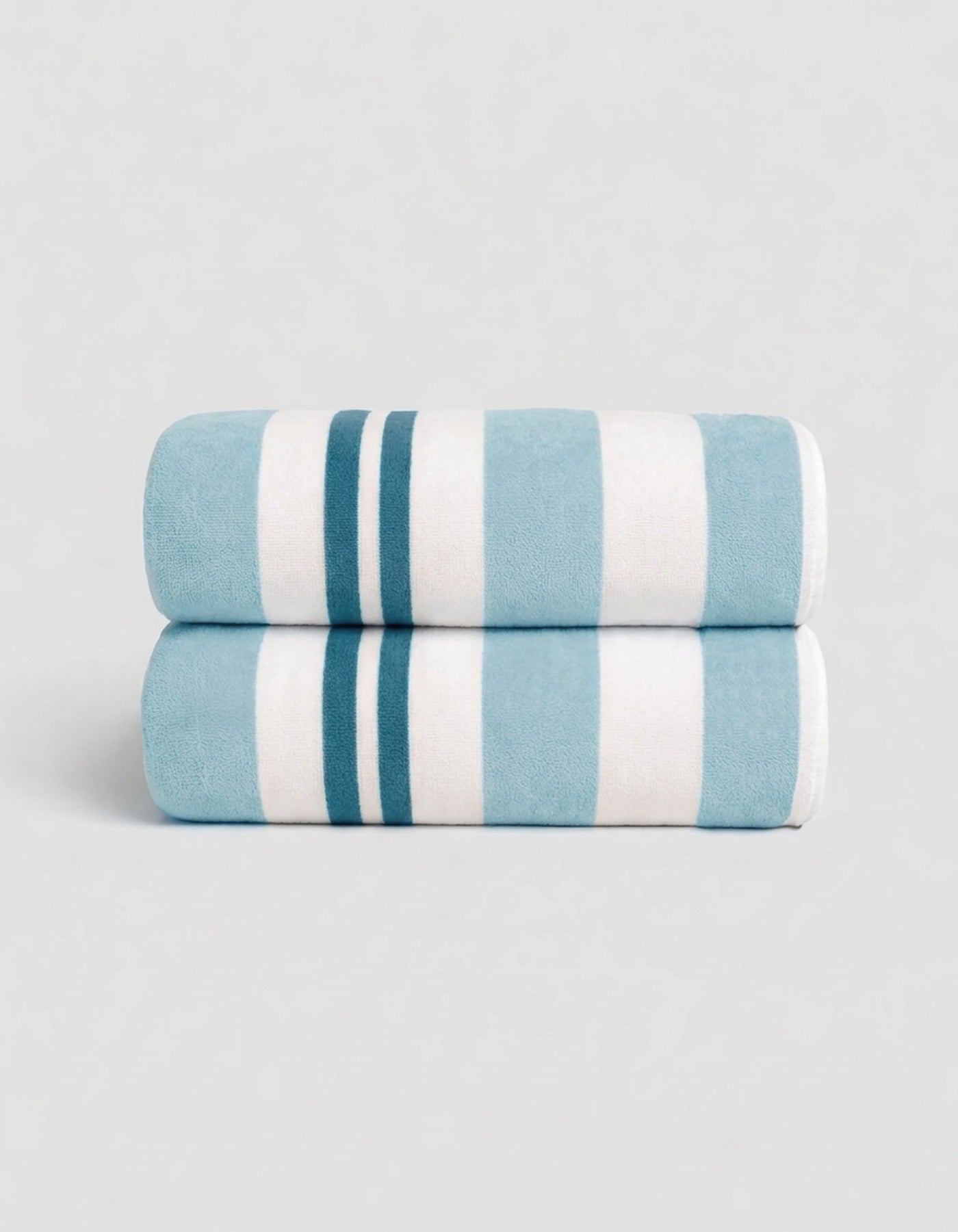The Cozy Earth Classic Stripe Resort Towel Bundle in Wave Stripe features two neatly folded towels, stacked together, with bold blue and white stripes against a simple light background.|Color:Wave Stripe