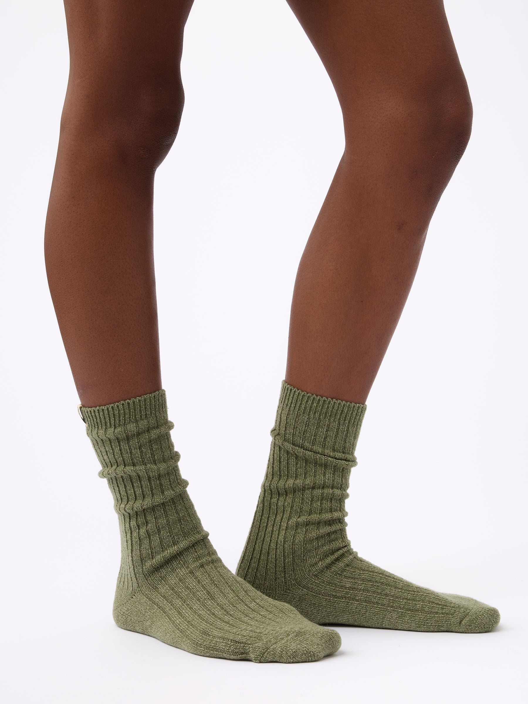 Person wearing Cozy Earth Plush Lounge Calf Sock in Juniper 