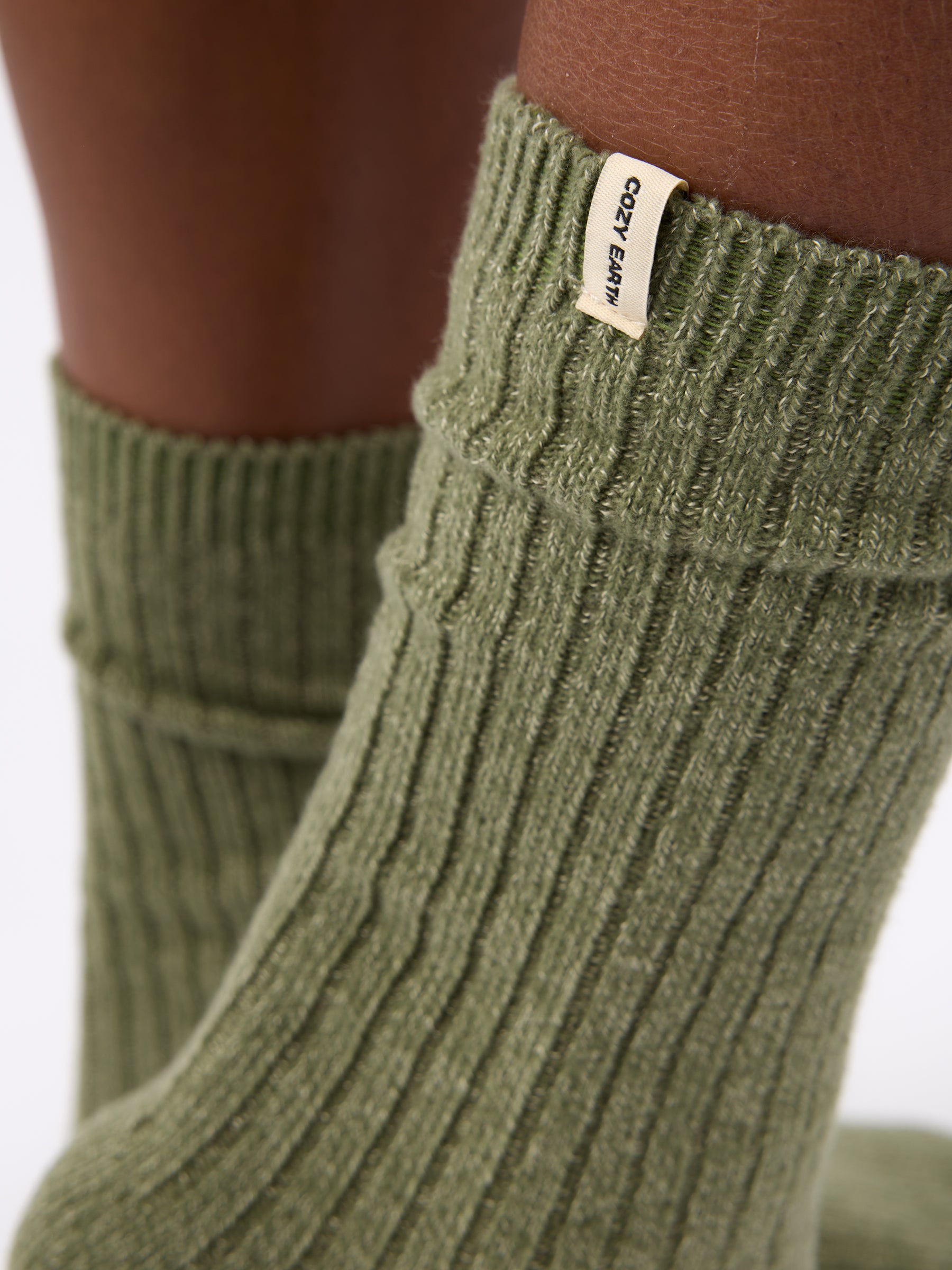 Close-up of tag on Cozy Earth Plush Lounge Calf Sock in Juniper 