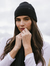 Woman wearing a black knit beanie and scarf on a white background |Color:Black