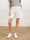 A woman shown from the waist down models Cozy Earth’s Women’s Brushed Bamboo Bermuda Shorts, featuring a drawstring waistband in white, paired with a grey top. |Color:Ivory