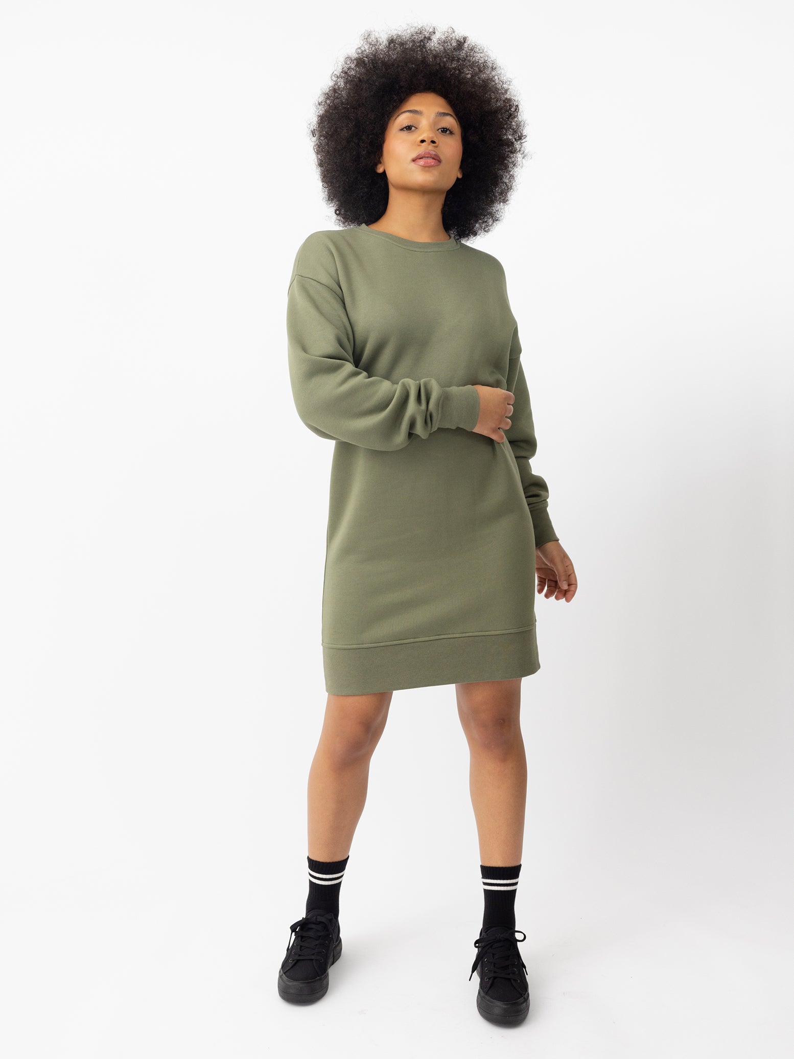 Woman wearing Juniper CityScape Crewneck Dress with white background |Color:Juniper