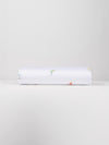 A neatly folded Bamboo Duvet Cover by Cozy Earth, showcasing small, colorful illustrations of people engaged in various activities against a plain white background. |Color:Skiers