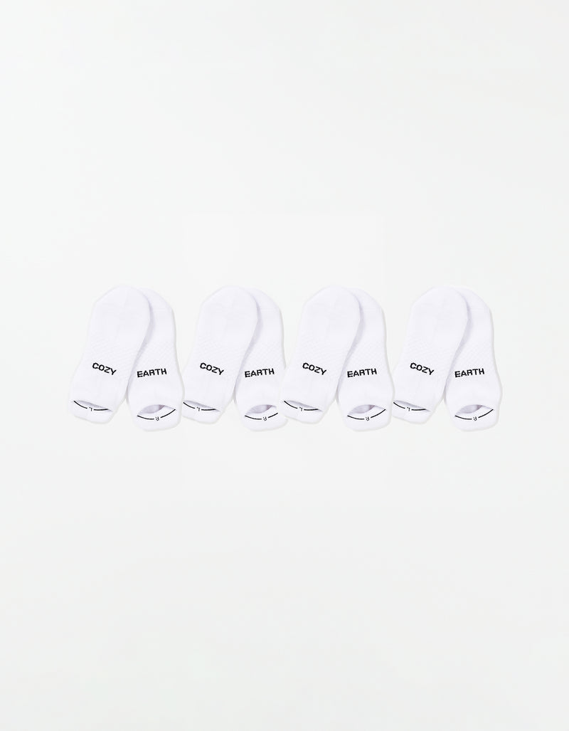 The Essential Ankle Sock 4-Pack by Cozy Earth features four pairs of white ankle socks, each with "COZY" and "EARTH" printed in black on top, arranged in a row on a white background.