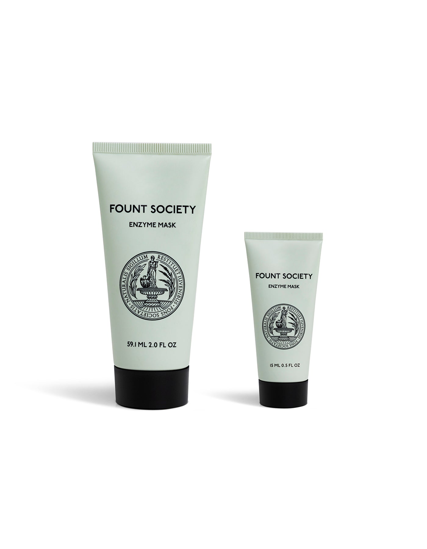 Two light green tubes of Cozy Earth Enzyme Mask—one large (2.0 fl oz) and one small (0.5 fl oz)—with black caps and vintage-style black logos stand upright against a white background.