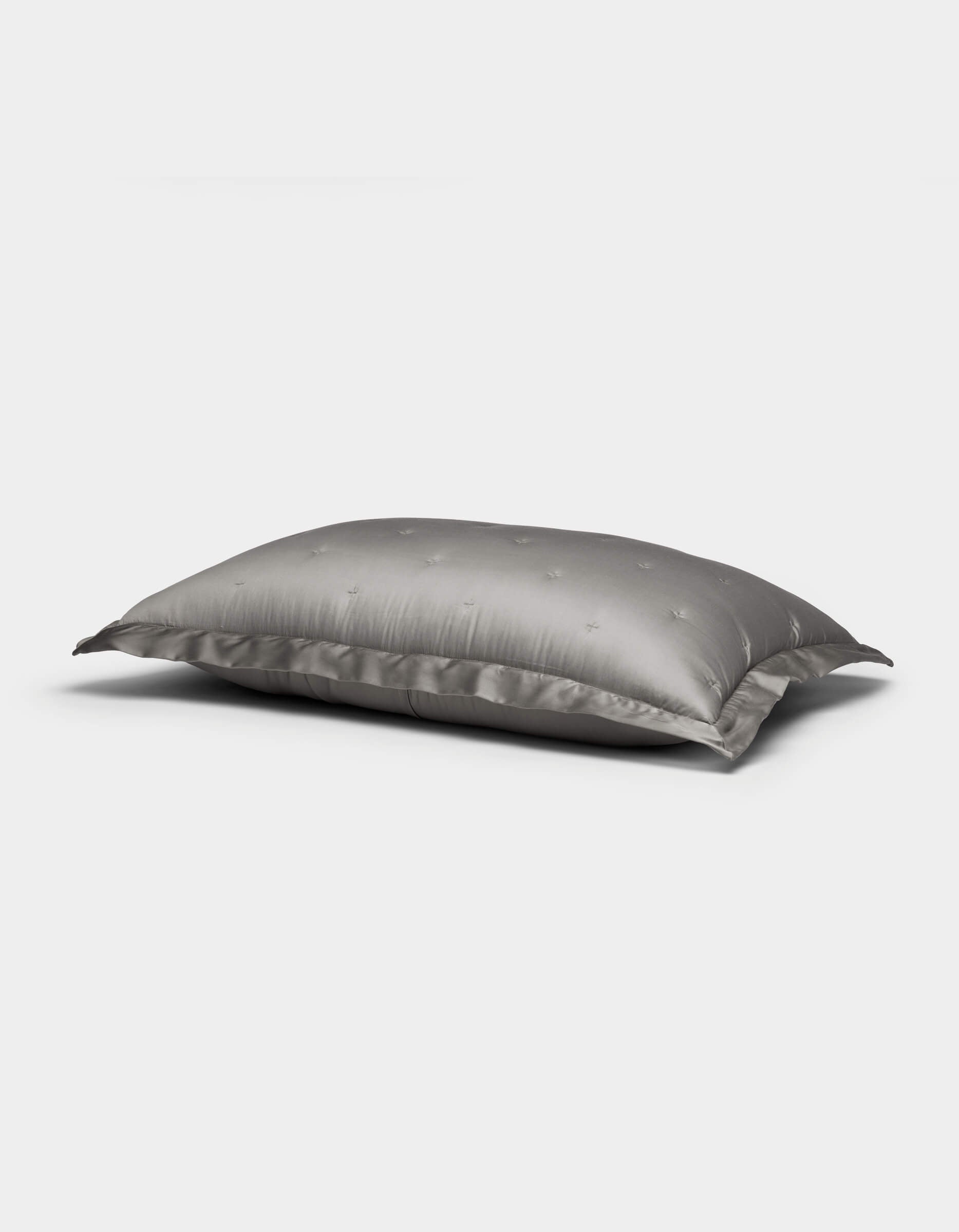 A single Cozy Earth Bamboo Quilted Sham in gray with a subtle star pattern is displayed on a plain white background.|Color:Charcoal