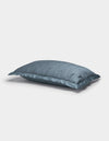 A blue Bamboo Quilted Sham by Cozy Earth lies on a white background, showcasing its soft, slightly wrinkled surface and smooth, glossy fabric.|Color:Pacific Blue