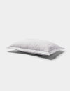 The Cozy Earth Bamboo Quilted Sham, with its smooth surface and lightly ruffled edges, rests on a plain white background and casts a gentle shadow below.|Color:White