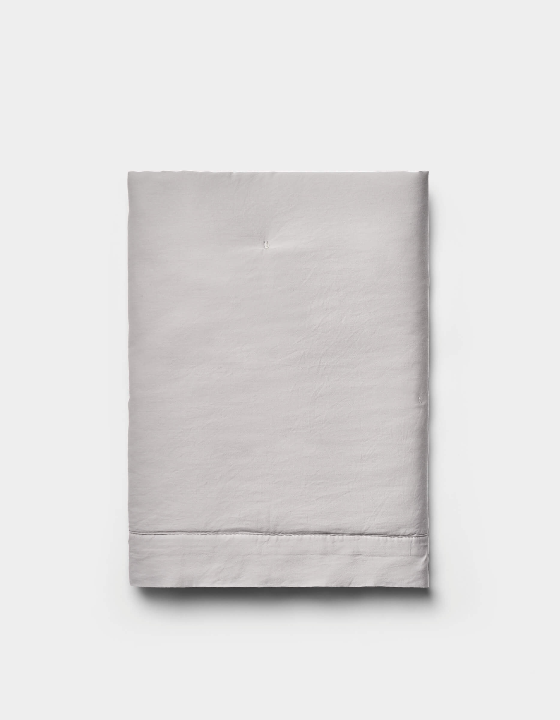 The Cozy Earth Soft-Wash Cotton Quilted Shams are shown neatly folded in light gray against a plain white background.