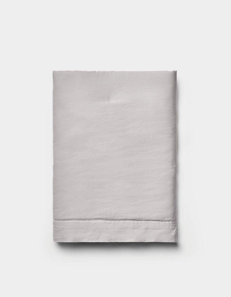 The Cozy Earth Soft-Wash Cotton Quilted Shams are shown neatly folded in light gray against a plain white background.