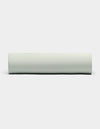 A Bamboo Fitted Sheet by Cozy Earth is displayed against a plain white background, viewed from the side. |Color:Laurel