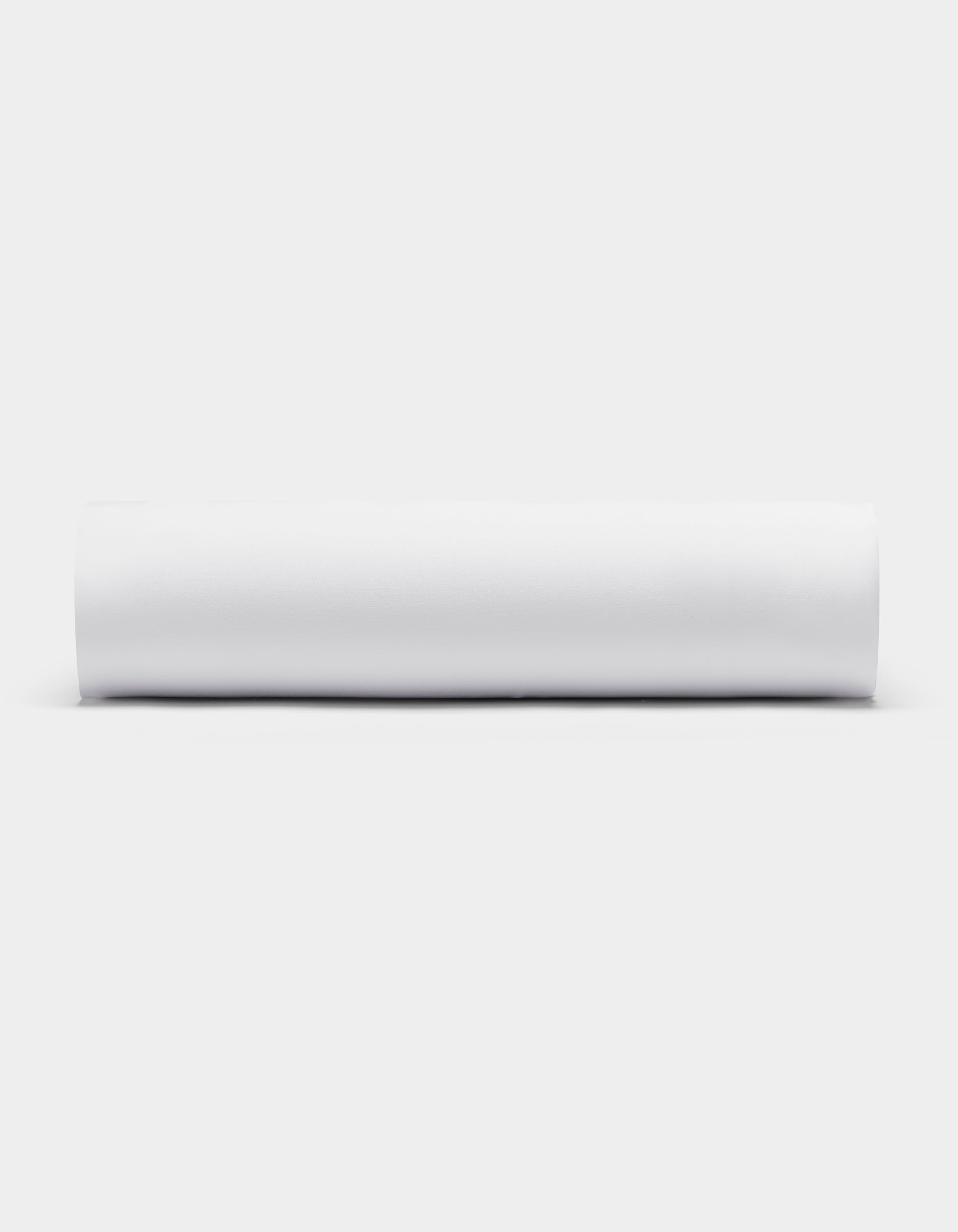 A Cozy Earth Bamboo Fitted Sheet, neatly rolled in a white cylinder, is displayed horizontally against a white background.