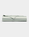 The Cozy Earth Bamboo Flat Sheet, in a light gray shade, is shown neatly folded with smooth edges on a plain white background.|Color:Laurel