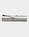 The Cozy Earth Bamboo Flat Sheet, shown in light gray with one corner folded over, is neatly rolled up and displayed against a plain white background.|Color:Light Grey