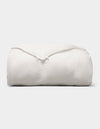 The Cozy Earth Down Alternative Comforter is neatly folded and fluffy, displayed against a plain light gray background. |Filling:Lightweight