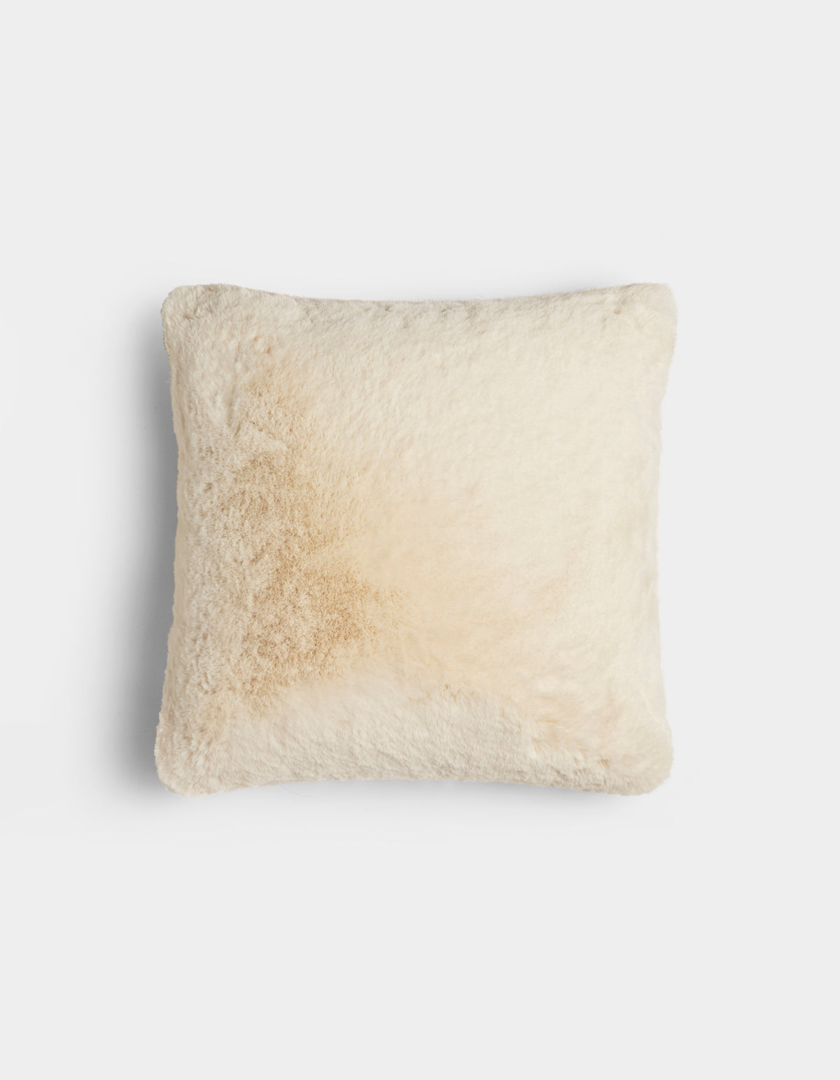 The Cozy Earth Cuddle Pillow is a square, fluffy, cream-colored pillow with a subtle light brown stain on one side, shown against a plain white background.|Color:Creme |Size:20" x 20"