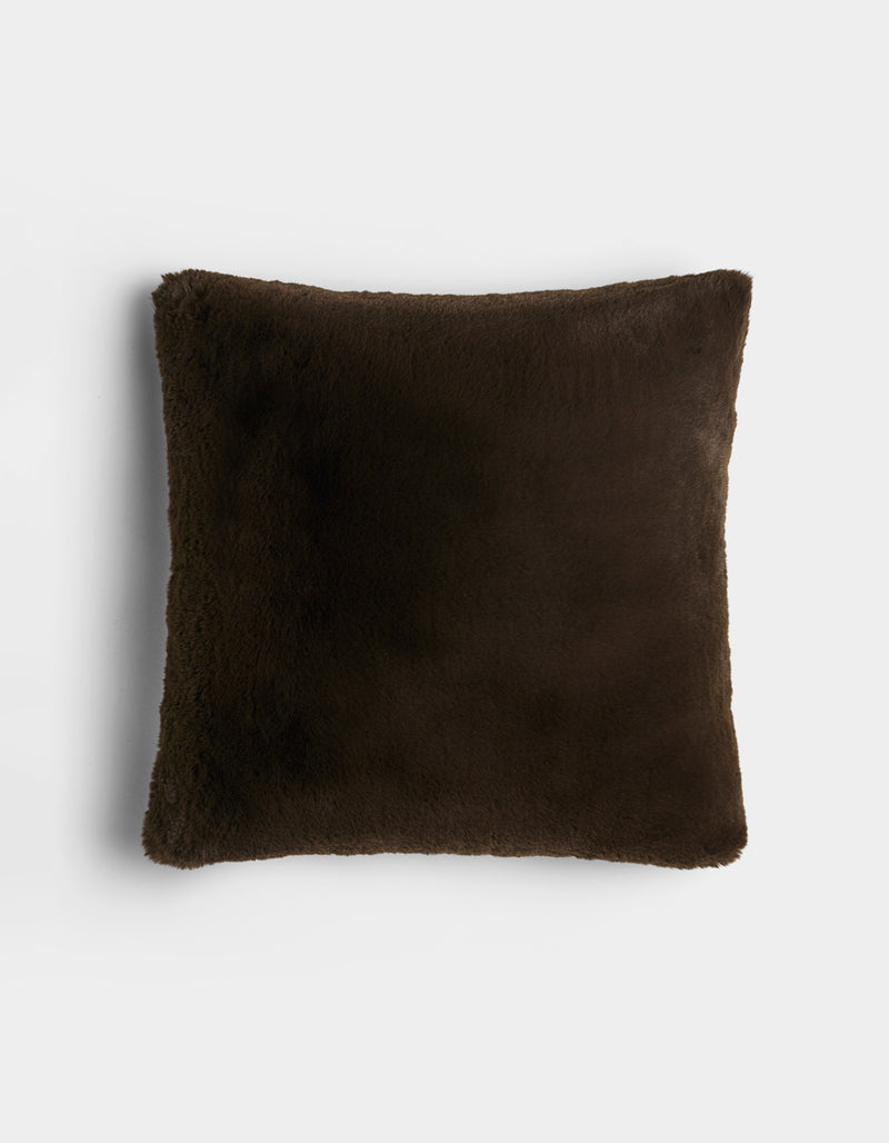 The Cozy Earth Cuddle Pillow is a square, dark brown plush pillow with a soft, fuzzy texture, displayed against a plain white background.