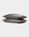 Two Cozy Earth Bamboo Pillowcases in gray are stacked together against a plain light background.|Color:Charcoal