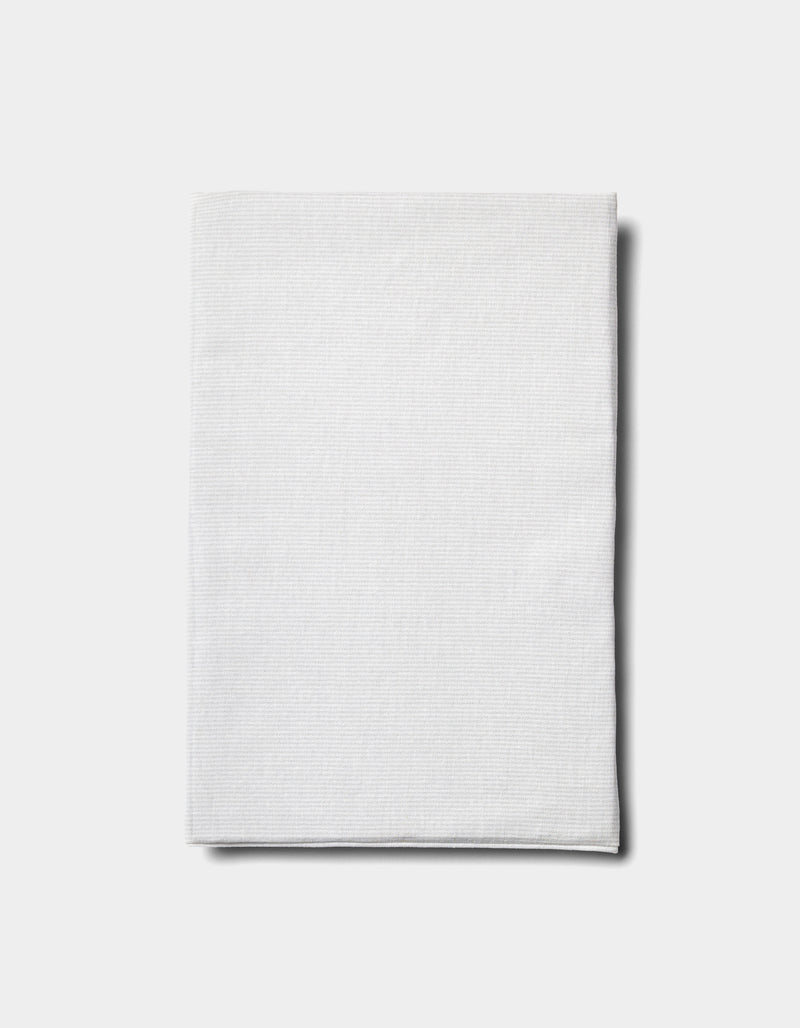 The Baja Double Sided Sham by Cozy Earth is neatly folded and displayed on a plain light gray background.