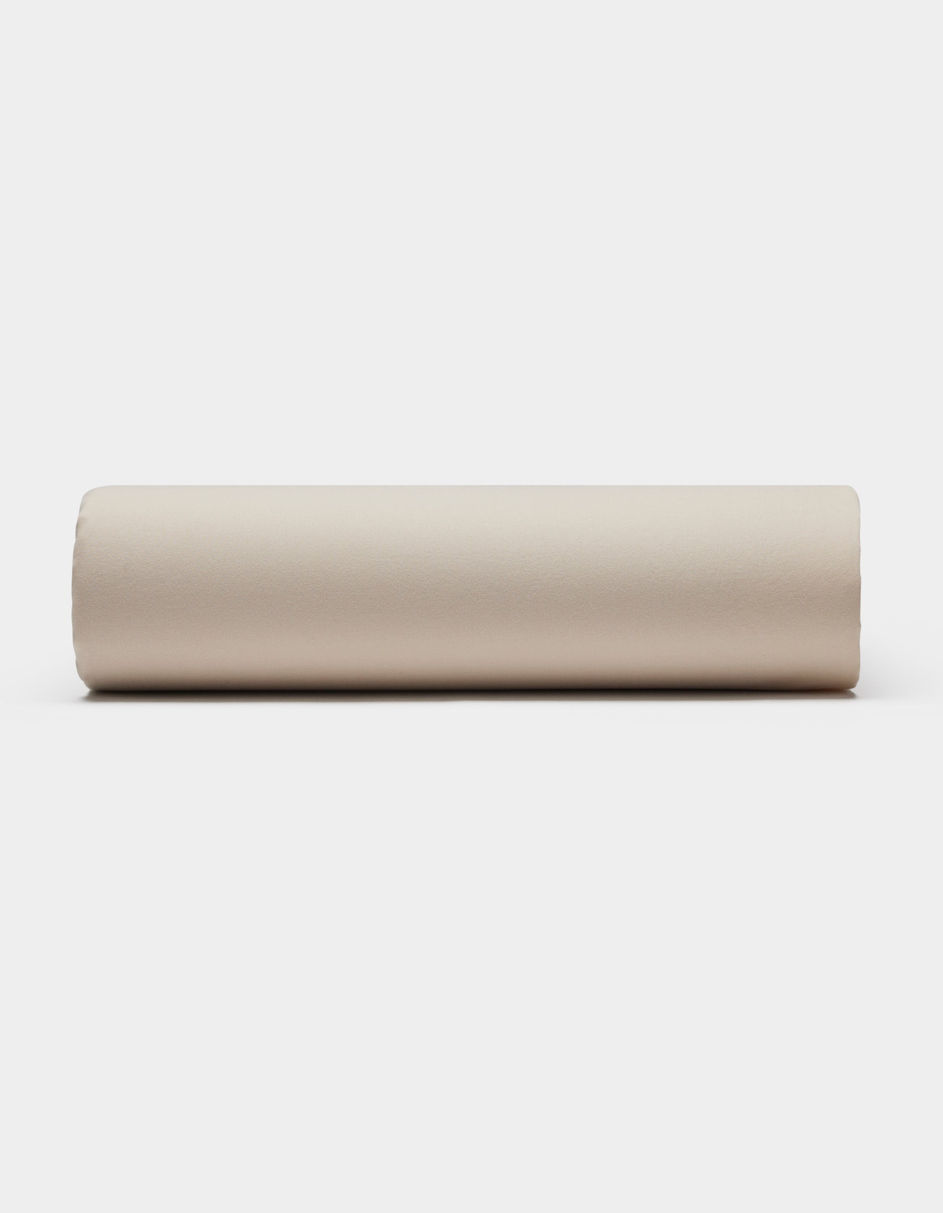 A Soft-Wash Cotton Fitted Sheet by Cozy Earth is displayed flat on a plain white background.