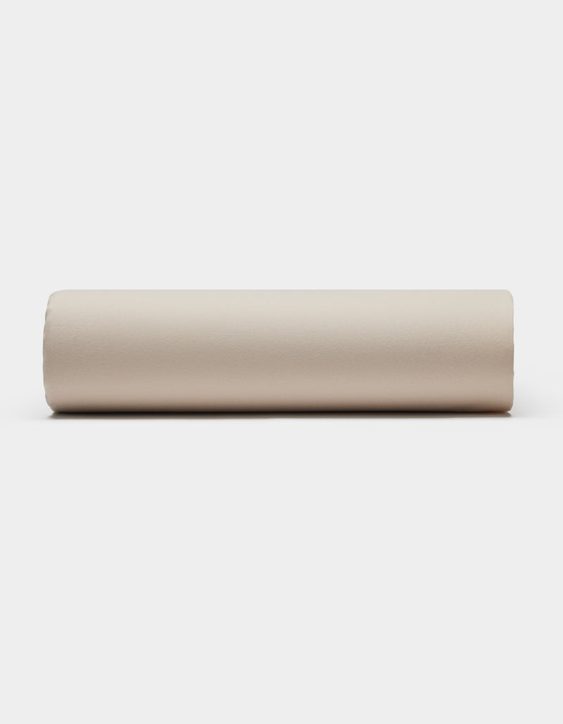 A Soft-Wash Cotton Fitted Sheet by Cozy Earth is displayed flat on a plain white background.