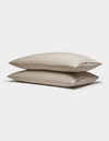 Two Soft-Wash Cotton Pillowcases by Cozy Earth are stacked together against a plain white background.|Color:Driftwood