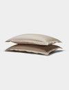 Two Soft-Wash Cotton Quilted Shams by Cozy Earth, in beige, stacked atop each other against a plain white background.|Color:Driftwood