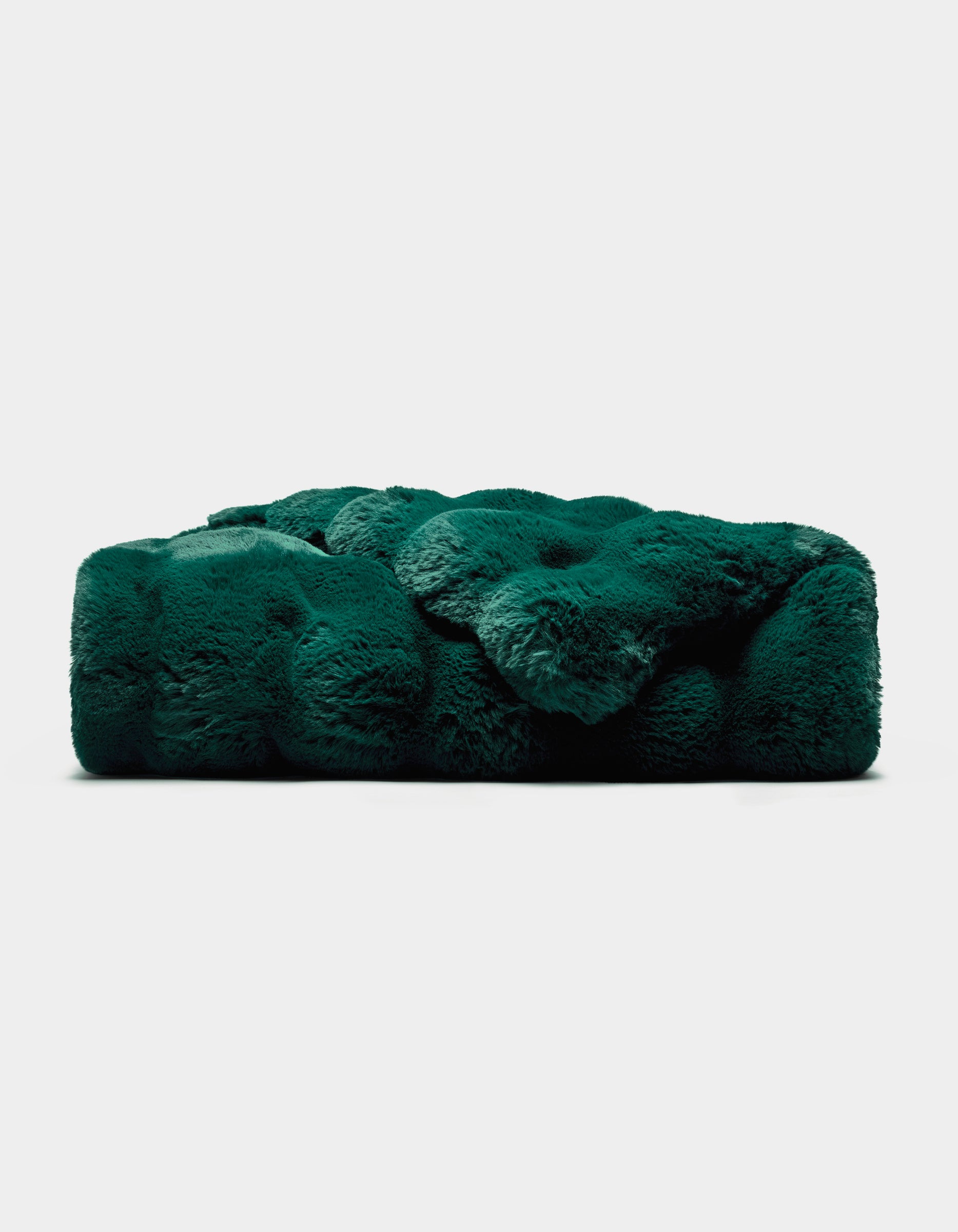 The Cozy Earth Double Bubble Cuddle Blanket is a plush, dark green rectangular throw with a soft, furry texture, displayed against a plain white background.