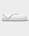 The Cozy Earth Bamboo Jersey Flat Sheet is neatly folded with a corner turned back, showcased against a plain light gray background.|Color:White