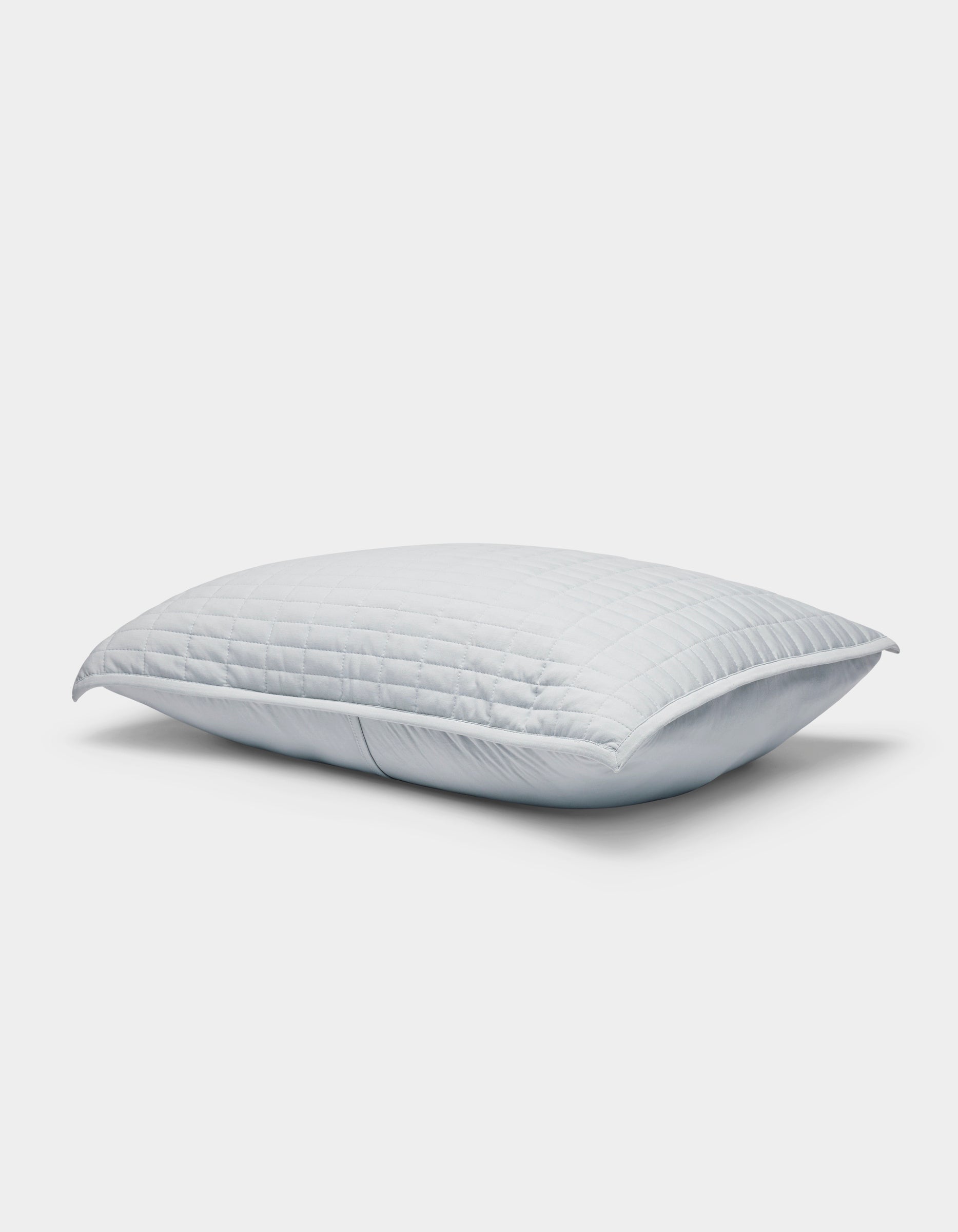 A single Cozy Earth Bamboo Jersey Quilted Sham in white, featuring a smooth surface with a subtle square pattern, displayed on a light gray background.|Color:Shore