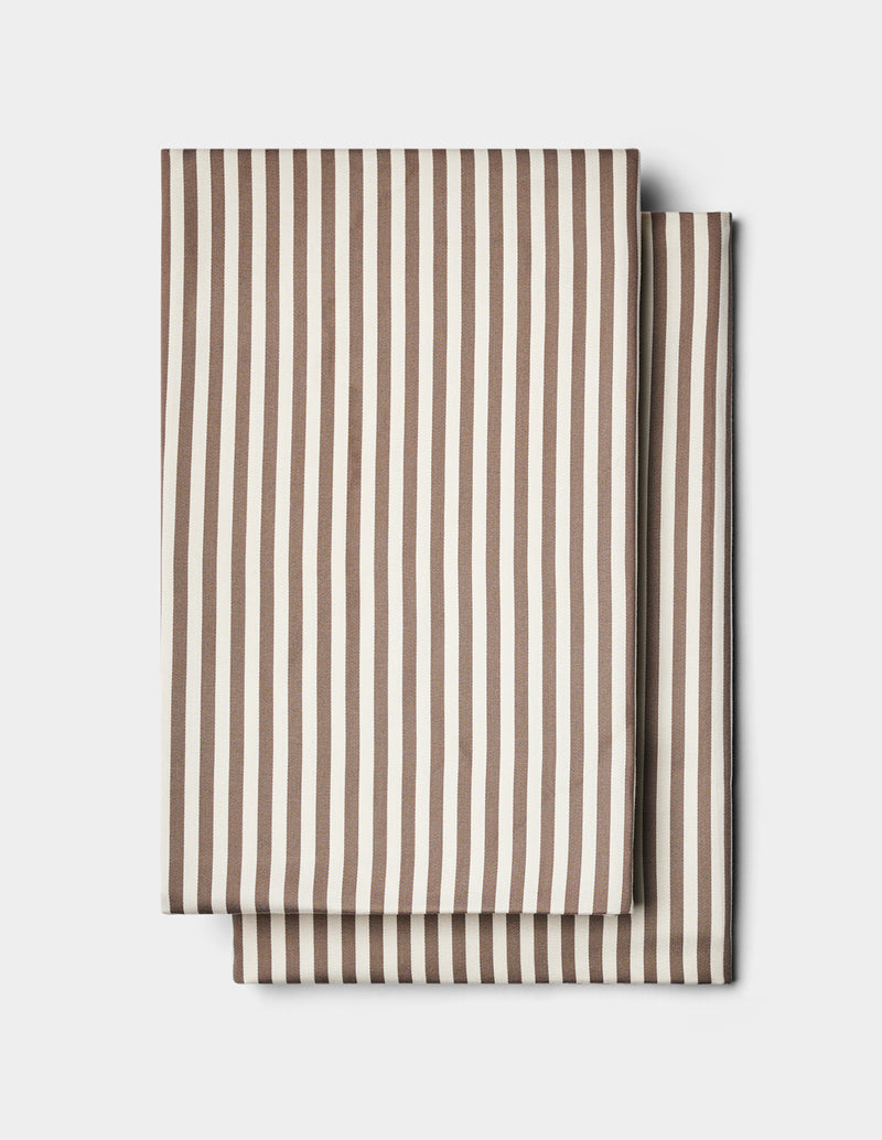 Two folded Cozy Earth Bamboo Pillowcases with vertical brown and white stripes, stacked on a plain white background.