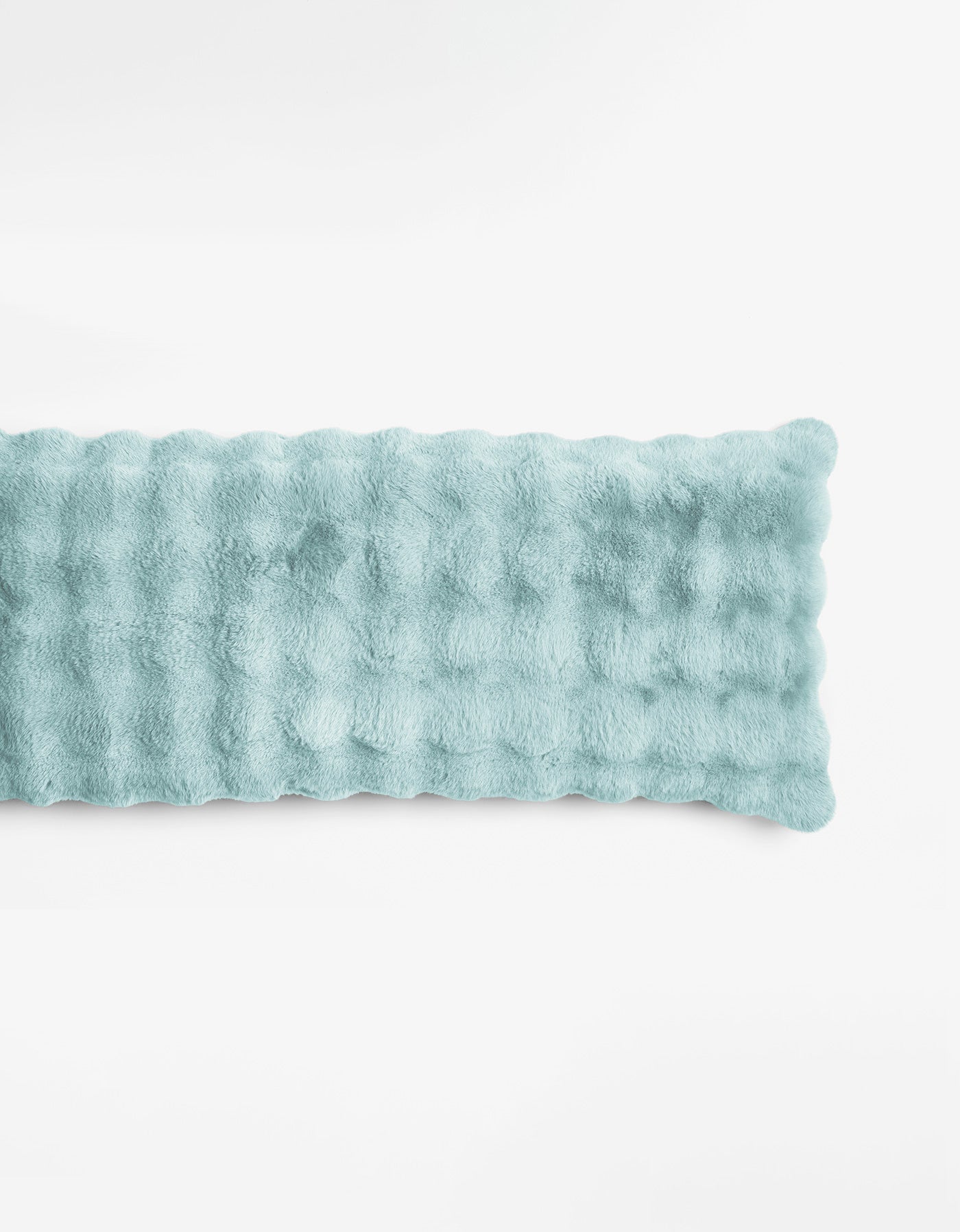 The Bubble Cuddle Pillow by Cozy Earth is a rectangular, blue-colored plush pad with a soft, furry texture, shown lying flat on a plain white background.|Color:Tide |Size:Body