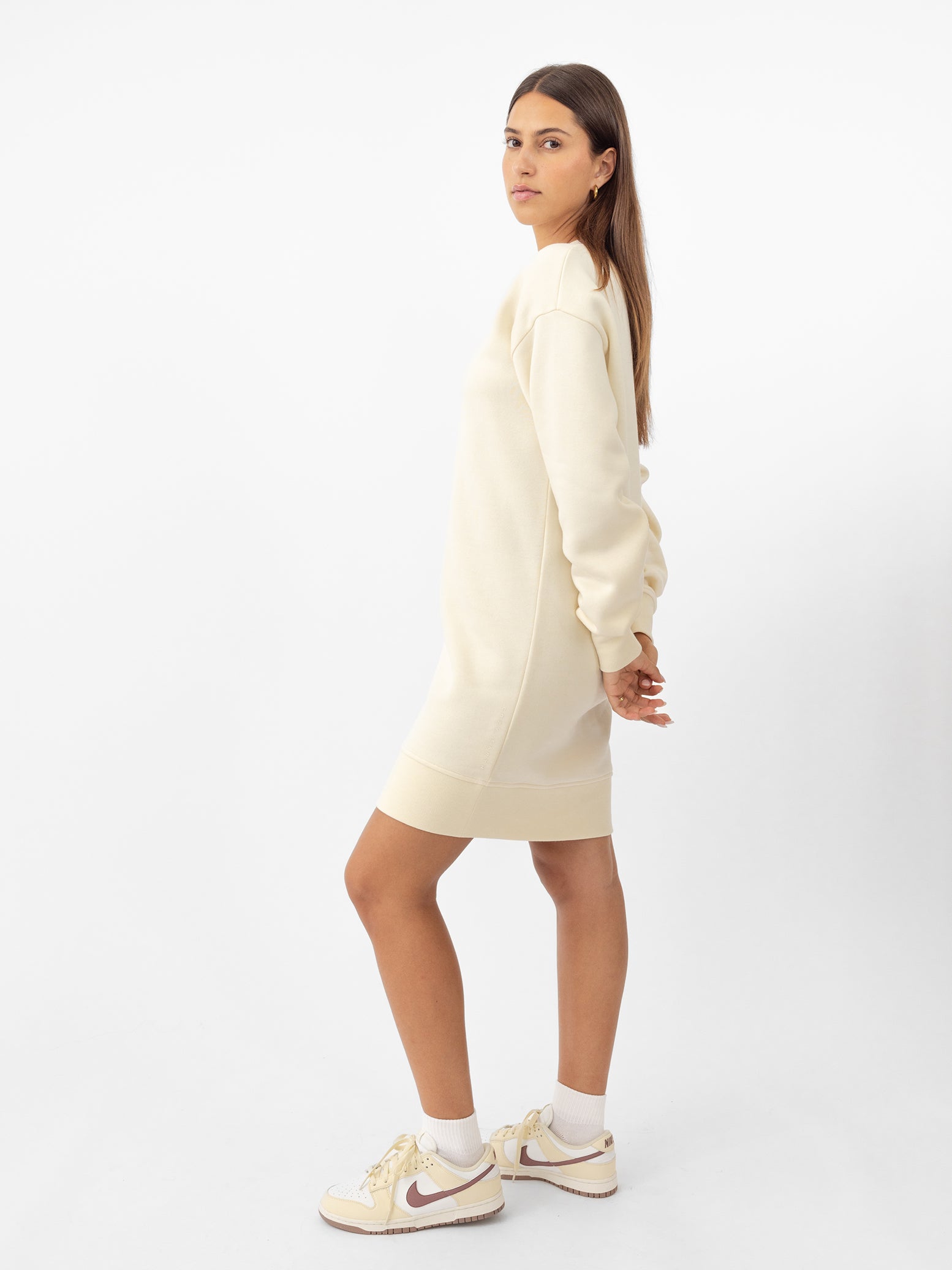 Woman wearing Alabaster CityScape Crewneck Dress with white background |Color:Alabaster