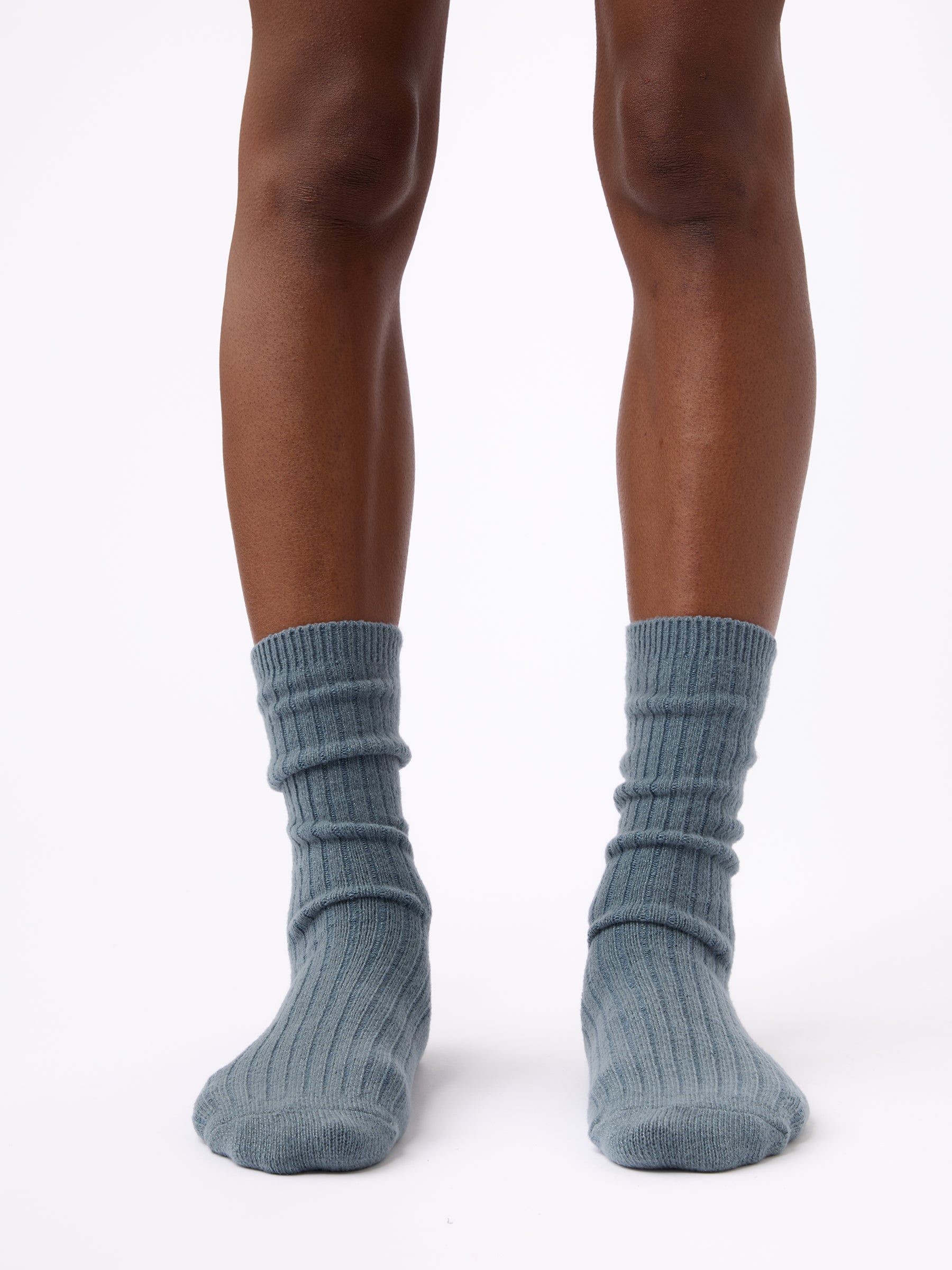 Person wearing Cozy Earth Plush Lounge Calf Sock 1-Pack in Deep Blue 