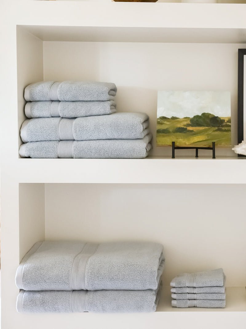 Complete luxe bath bundle folded on shelves 