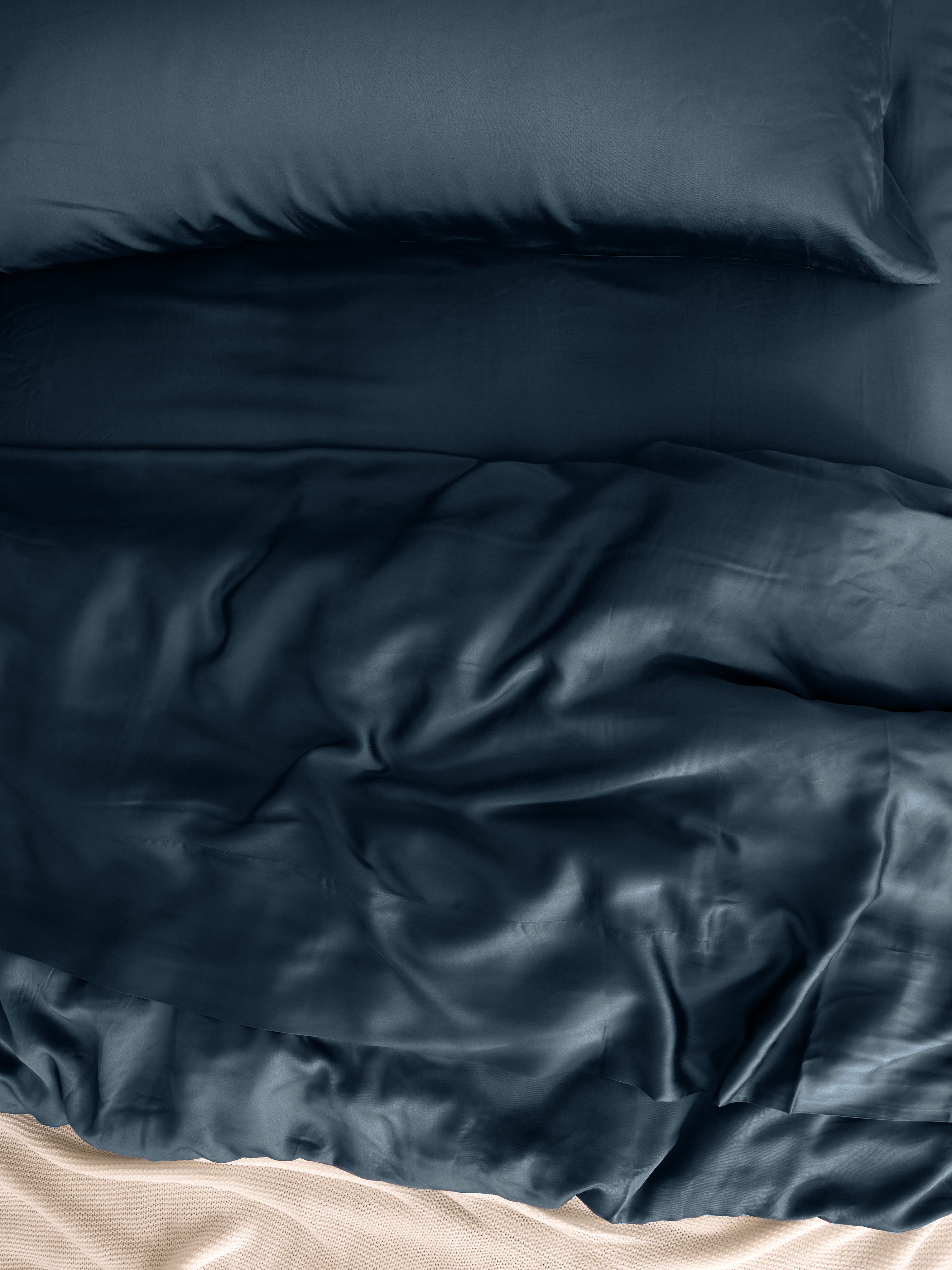 Close up of pacific blue bedding on bed |Color:Pacific Blue