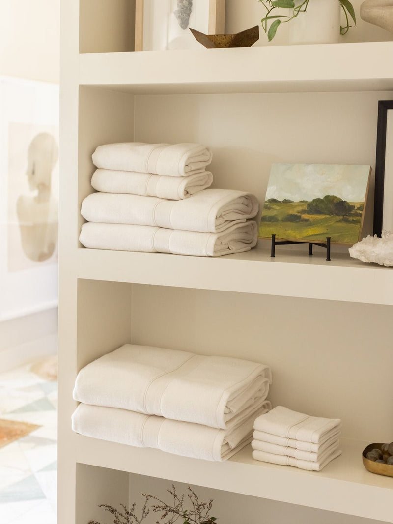 Complete luxe bath bundle folded on shelves