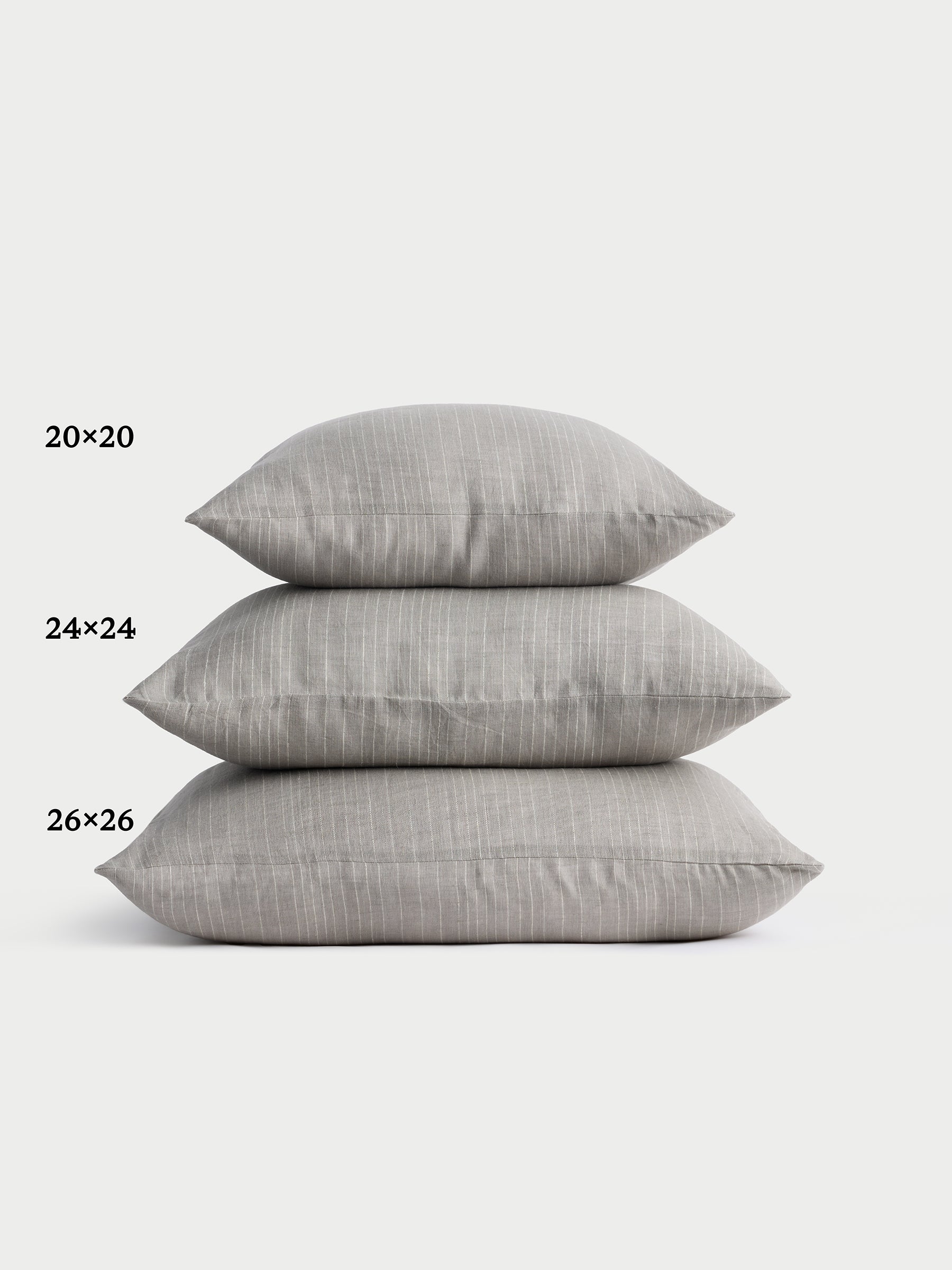 Cozy Earth striped throw pillow with plain white background 