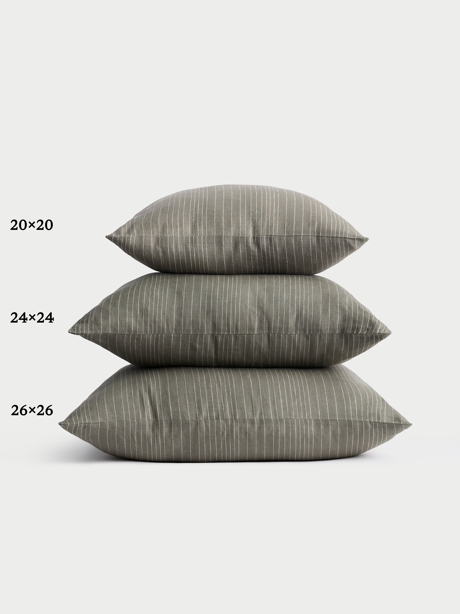 Cozy Earth striped throw pillow with plain white background 