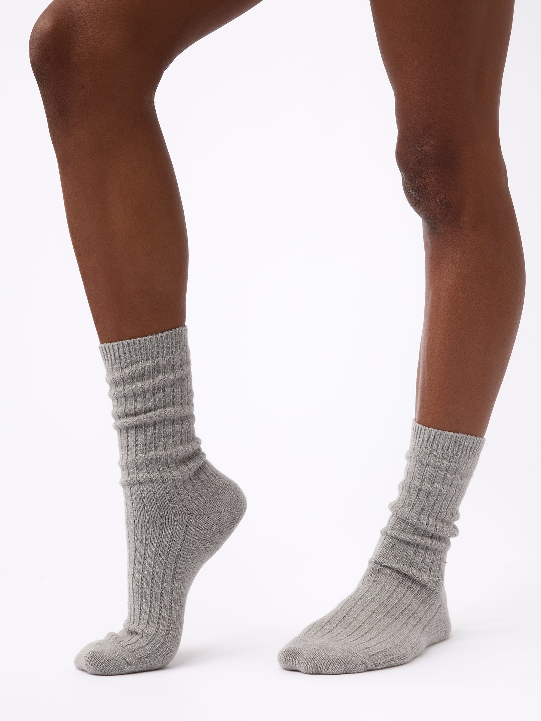 Person wearing Cozy Earth Plush Lounge Calf Sock 1-Pack in Stone |Color:Stone