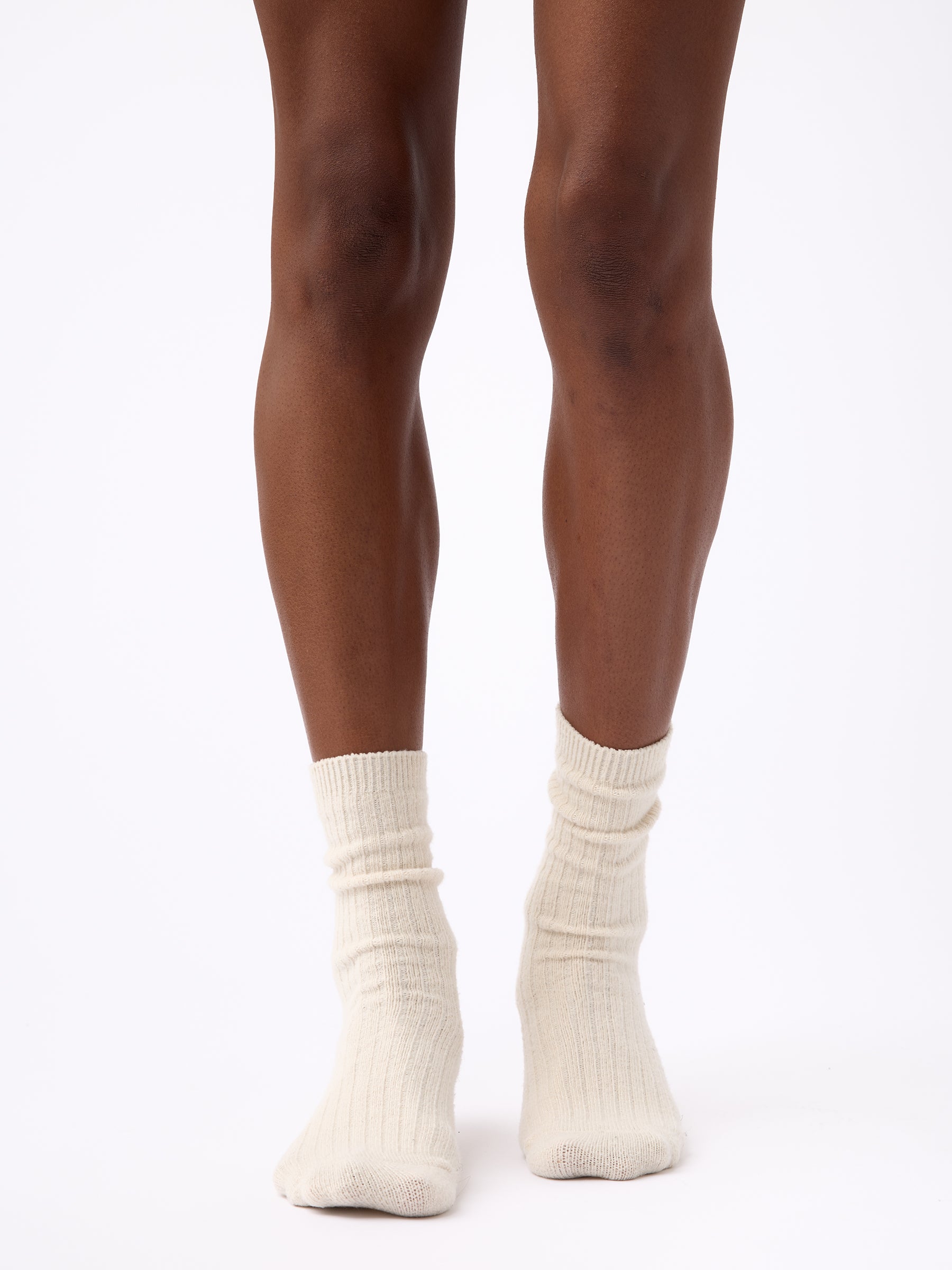 Person wearing Cozy Earth Plush Lounge Calf Sock 1-Pack in Alabaster 