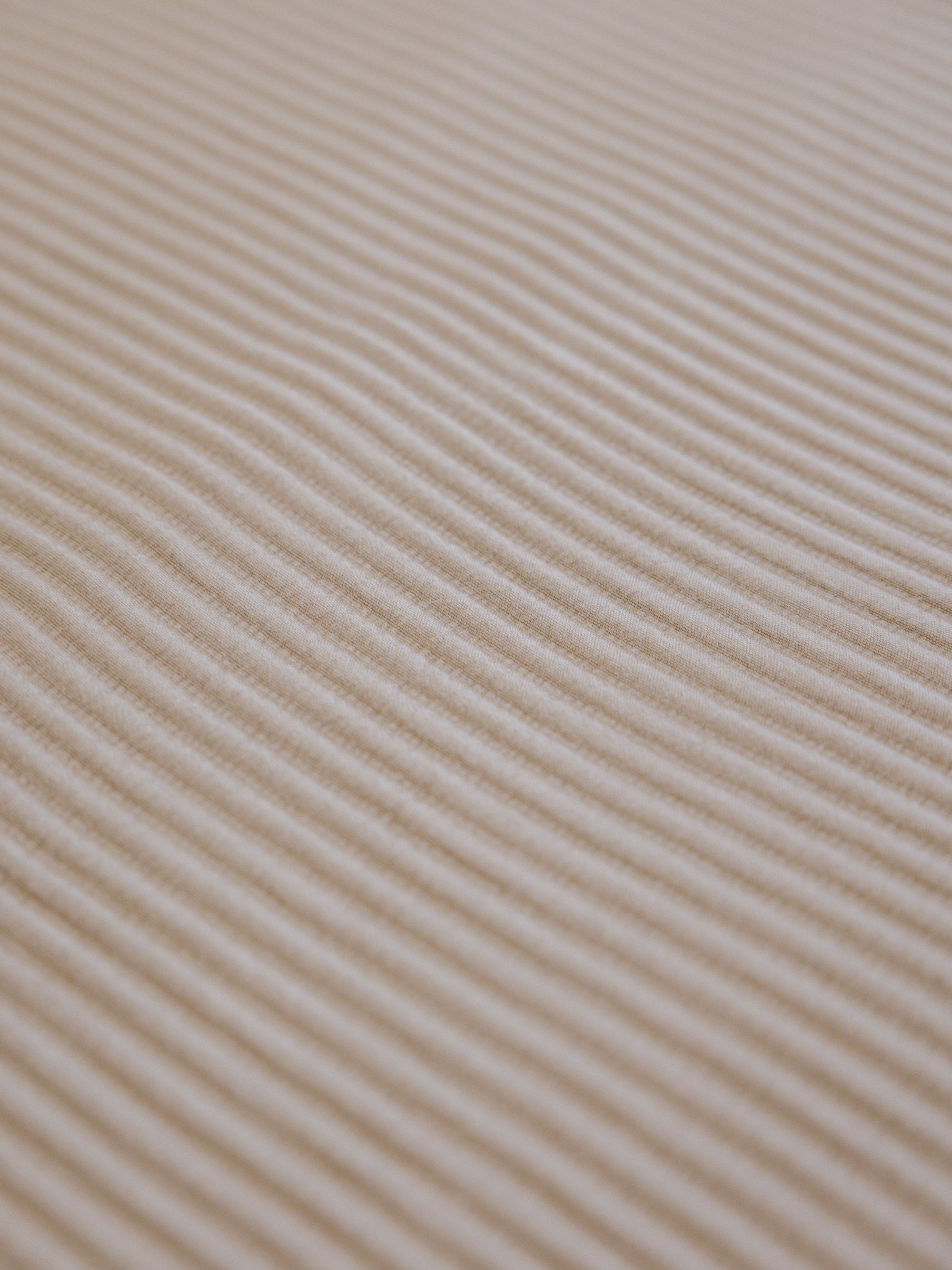 Close up of driftwood coverlet fabric 
