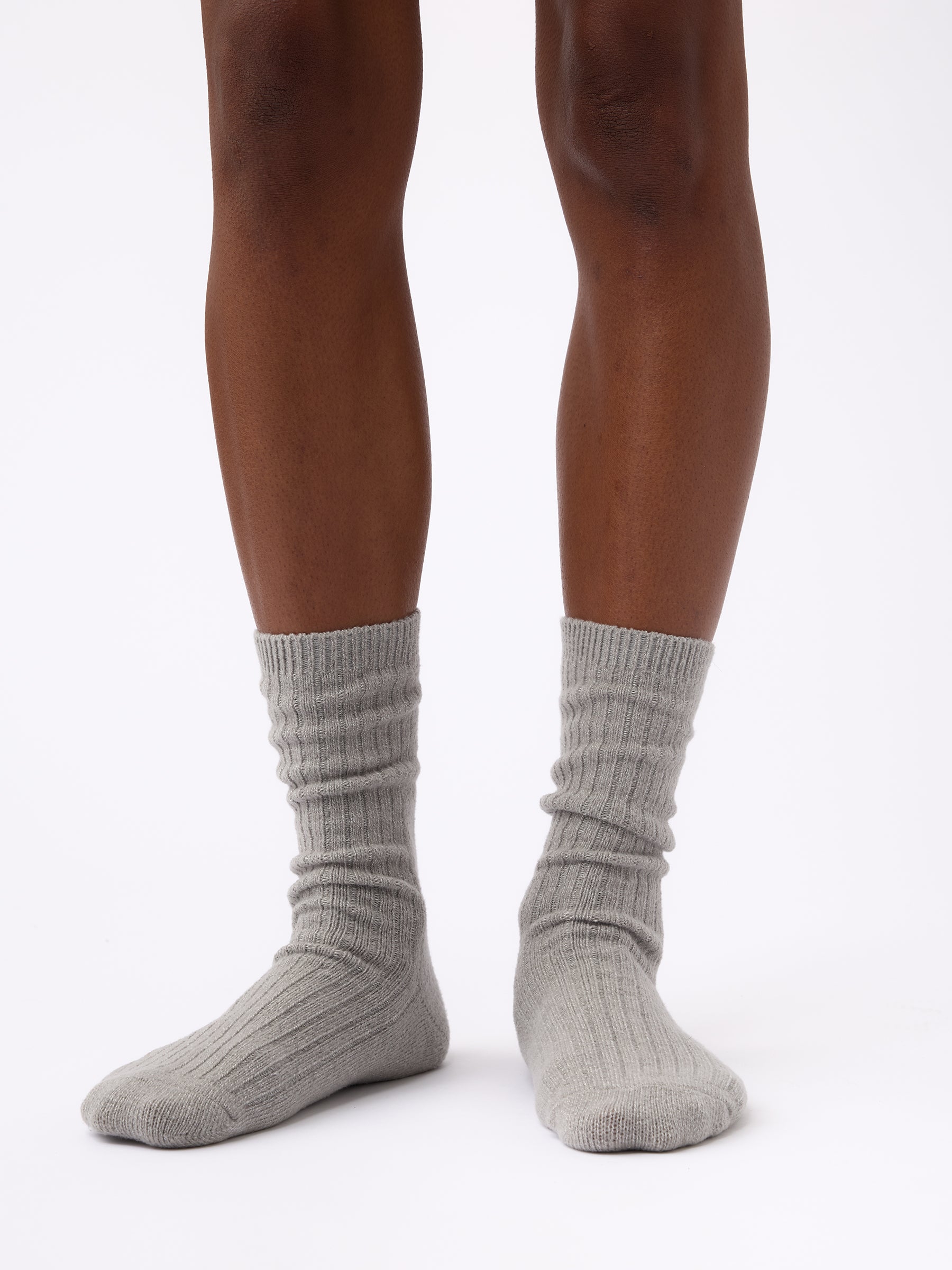 Person wearing Cozy Earth Plush Lounge Calf Sock 1-Pack in Stone 