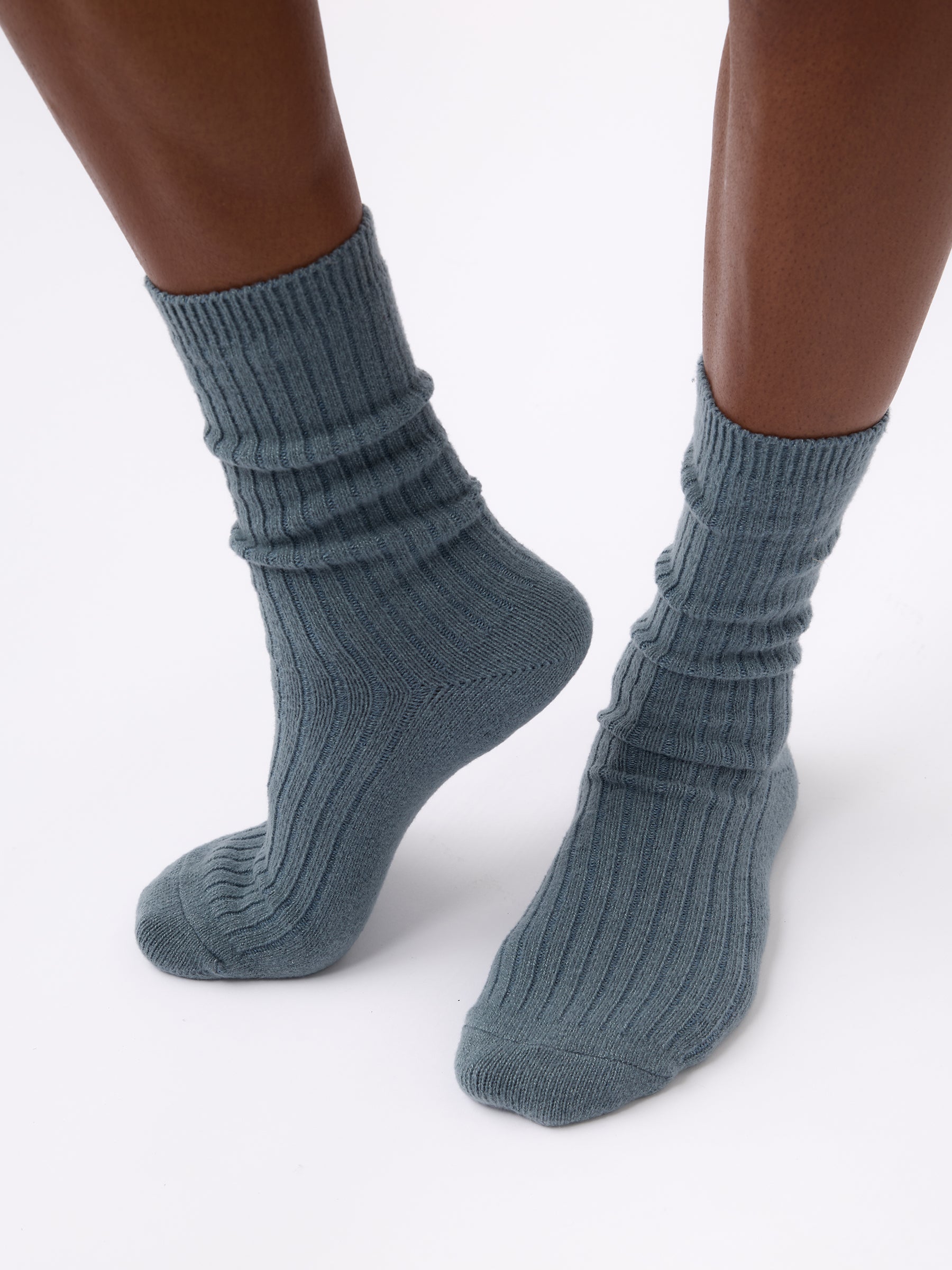 Person wearing Cozy Earth Plush Lounge Calf Sock 1-Pack in Deep Blue 