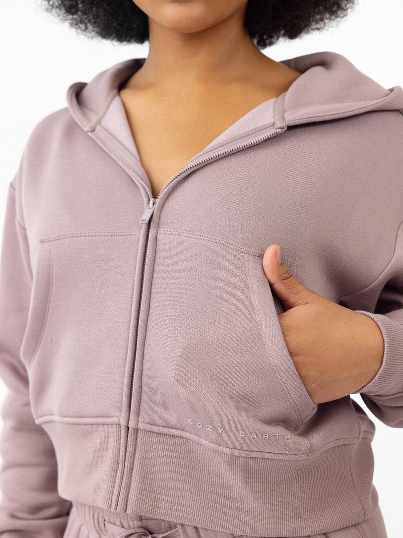 Woman wearing Dusty Orchid CityScape Cropped Full Zip with white background