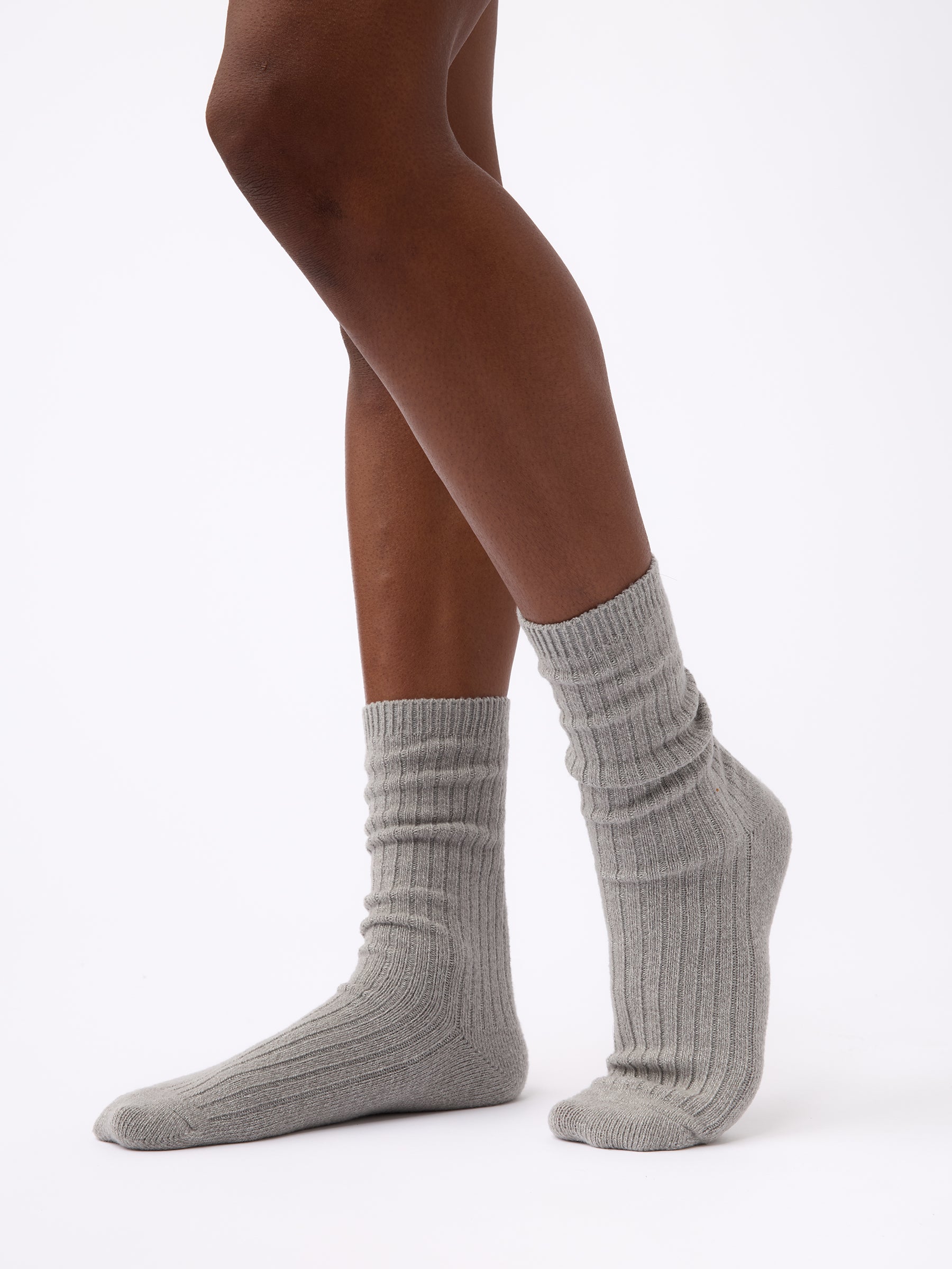 Woman wearing Cozy Earth Plush Lounge Calf Sock 1-Pack in Stone 