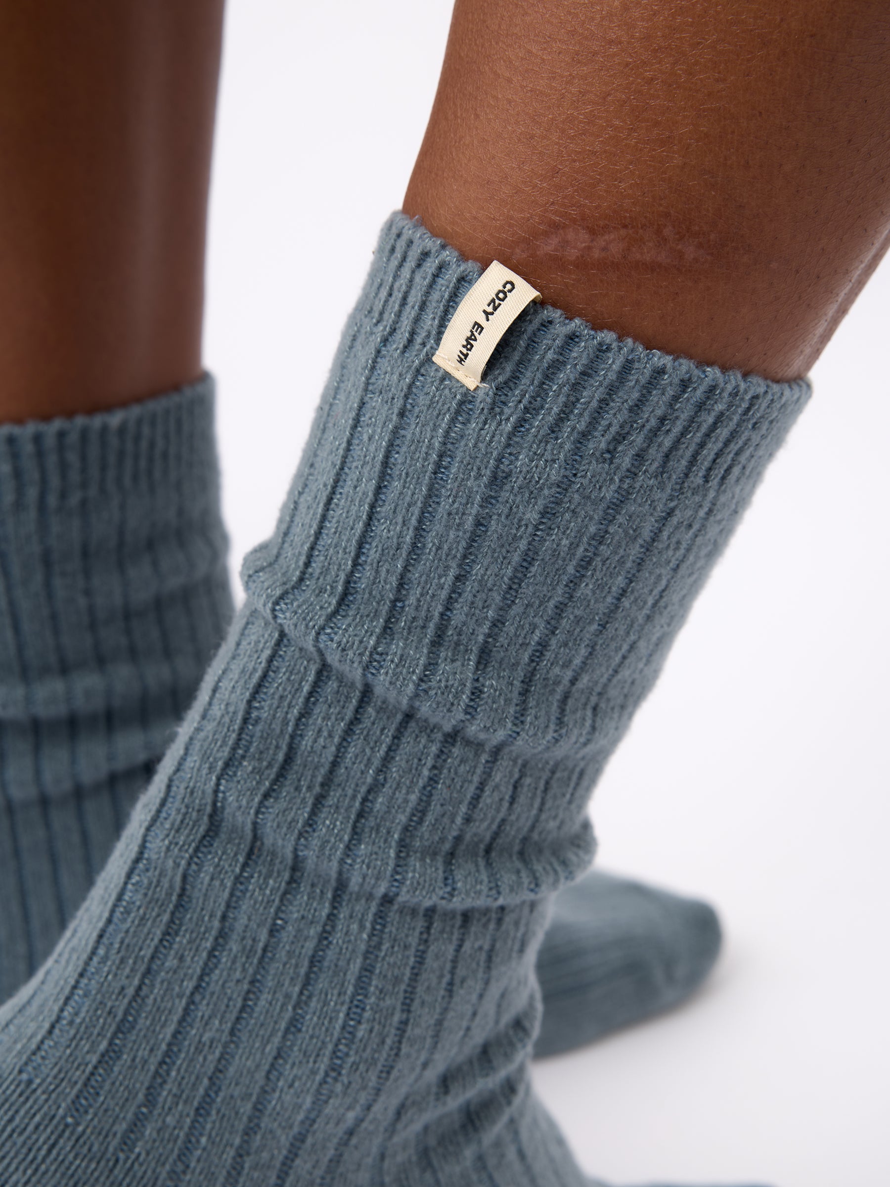 Close-up of the tag on Cozy Earth Plush Lounge Calf Sock 1-Pack in Deep Blue 