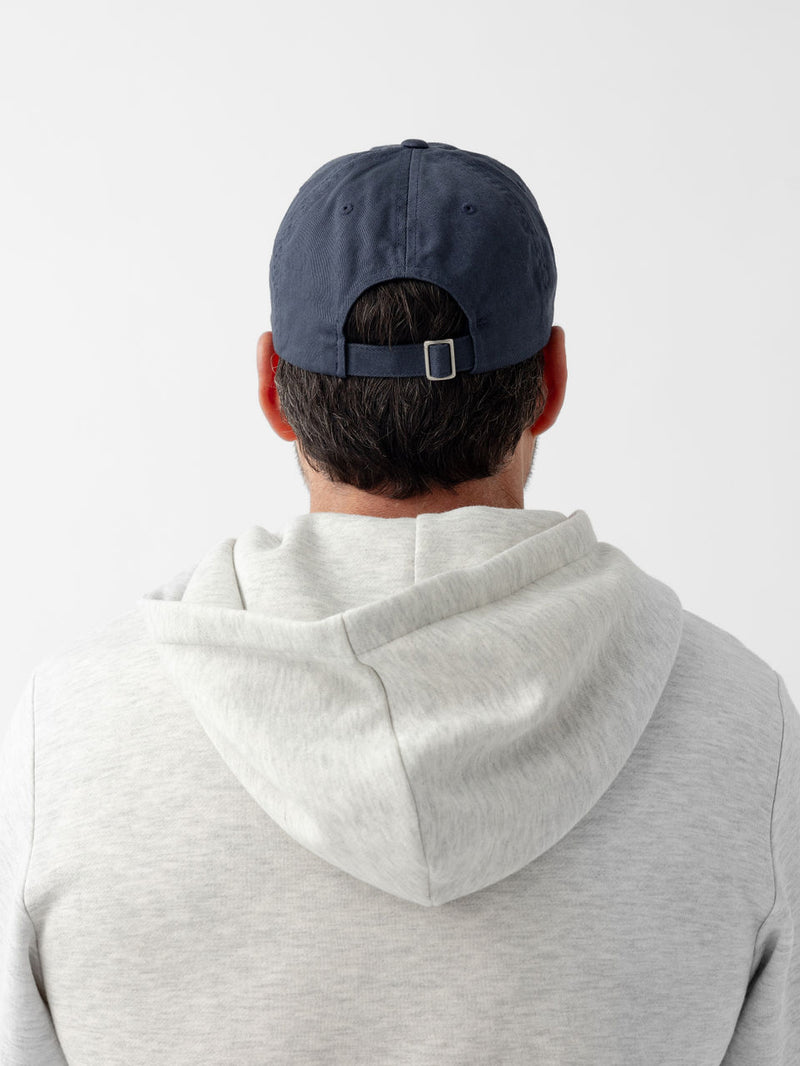 Back of man wearing washed navy vintage cap