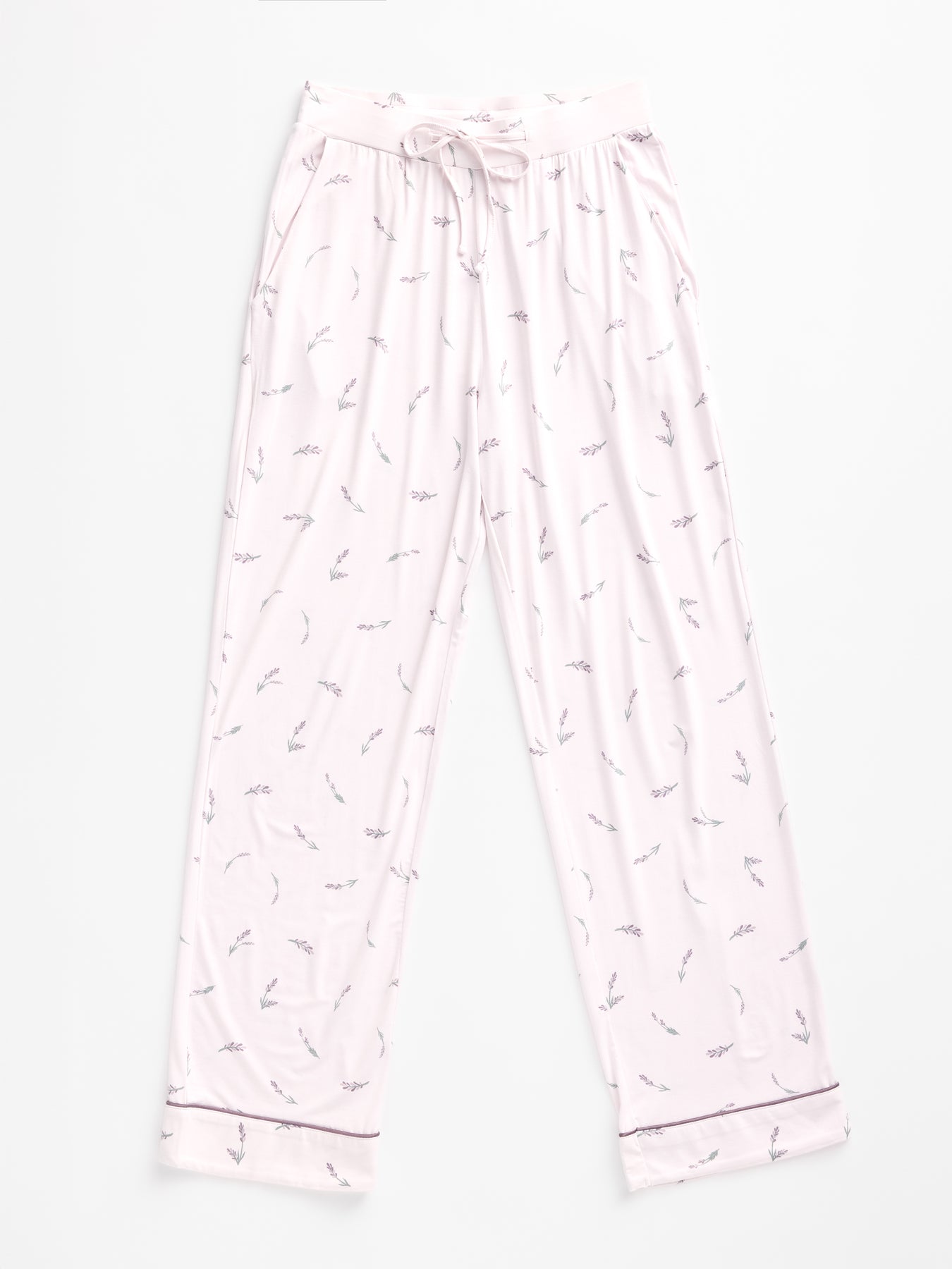 The Women's Bamboo Stretch-Knit Pajama Pant by Cozy Earth features a light purple color with a subtle leaf pattern, an elastic waistband, and drawstring. The fabric looks soft and cozy. 